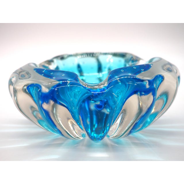 This is an exquisite piece of craftsmanship that showcases murano's skill in blending colored glass with clear glass,...