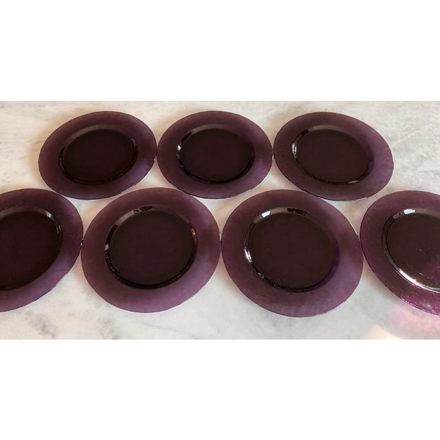 Set of 7 vintage deep purple glass dinner plates with textured rimmed edge. Made by the Italian Studio Bormioli Rocco in...