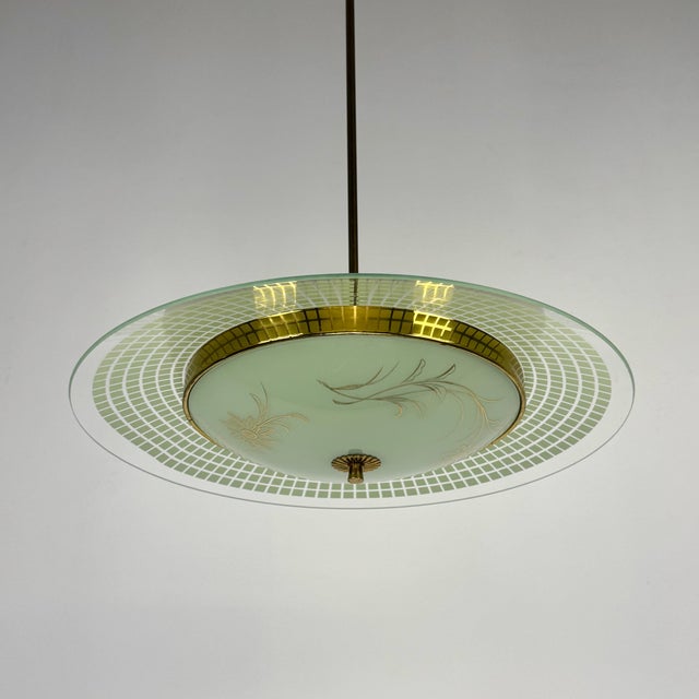 Mid-Century Modern Italian UFO Pendant Lamp by Pietro Chiesa for Fontana Arte, 1950s, in Very Good conditions. Designed...