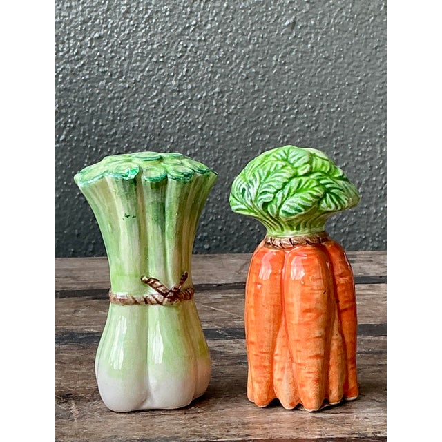 These whimsical vintage salt and pepper shakers are a delightful homage to the kitchen garden, capturing the organic charm...