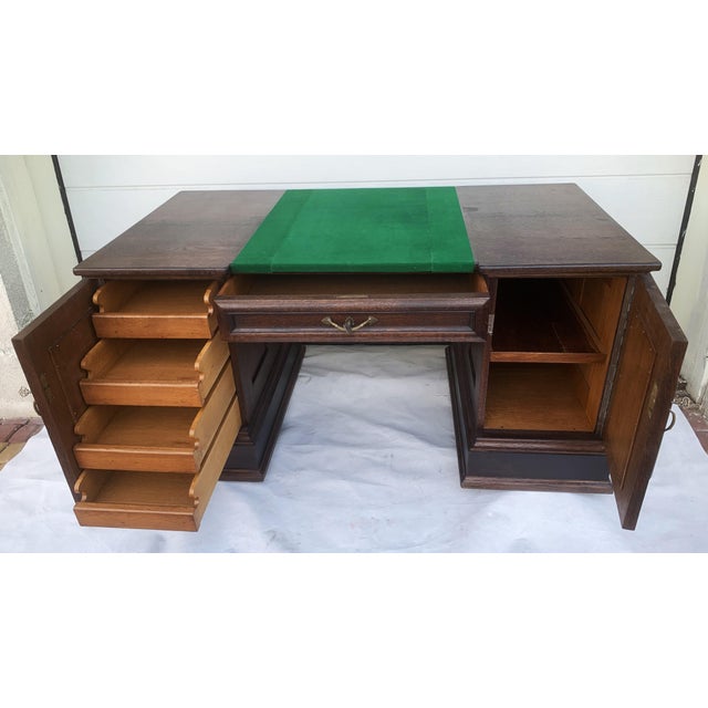 Solid oak executive desk in the Neo-Renaissance style, circa 1930 A classic executive desk in the Neo-Renaissance style,...