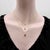 18k Gold 1/2 Carat Emerald Cut Diamond in Collet Setting With Black Rhodium Necklace For Sale - Image 9 of 12