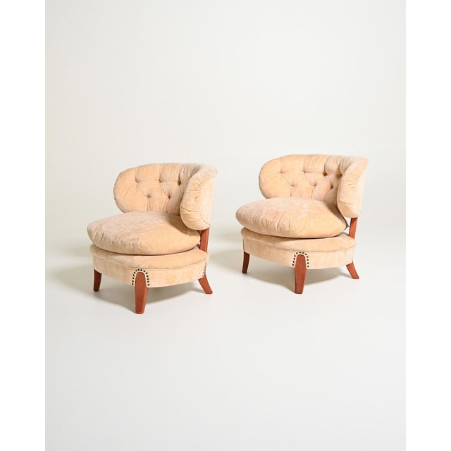 Upholstered armchairs with a wooden frame, velvet upholstery, and tufted backrest. Designed by Otto Schulz for Boet,...