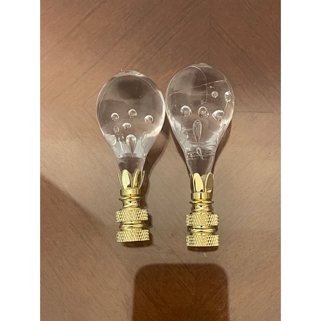 Antique French Blown glass with air bubbles on brass base as pair of lamp finials.