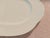 A like-new 13.5-inch platter by Villeroy & Boch in the "Arco Weiss" pattern of an embossed fan design, and a glossy white...