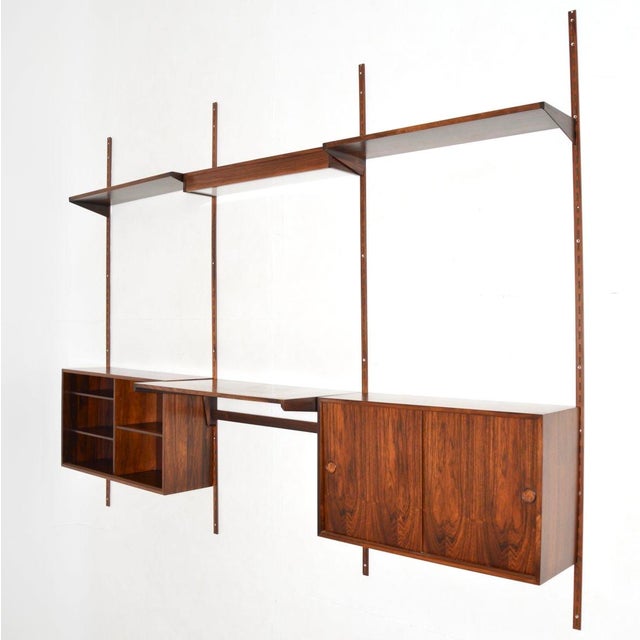 A superb danish vintage wall mounting shelving system. This was made in denmark by fm mobler, it dates from the 1960’s....