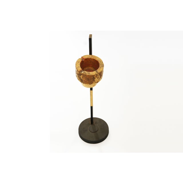 A striking vintage late 20th-century smoking stand, combining black metal with a beautifully contrasting gold-toned...