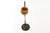 A striking vintage late 20th-century smoking stand, combining black metal with a beautifully contrasting gold-toned...
