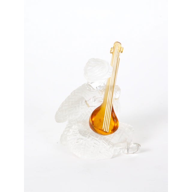An elegant decorative sculpture by Saint-Louis, the renowned French crystal manufacturer, depicting a delicate lyre with a...