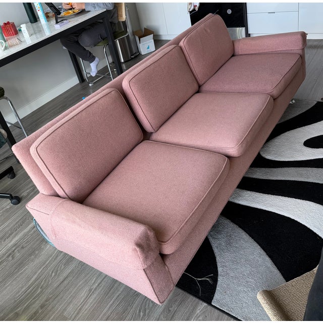 This 1950s Floence Knoll couch was my great grandfathers. He re-upholstered it from green to pink when they moved to match...