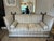 Classic knole style sofa by the luxury furniture maker George Smith having wooden finials, down seat cushions, matching...