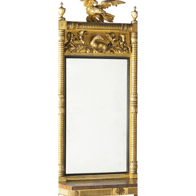 Empire style - 19th century. European; 19th century carved and gilded wood 'Eagle; deer and leaves'. Fluted columns and...