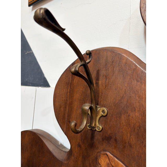 Exceptional and large Art Nouveau hall stand in carved wood, dating from the turn of the 20th century. This striking piece...