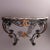 A French Louis XV style console table offers shaped and beveled marble top over basket weave wrought iron base having...