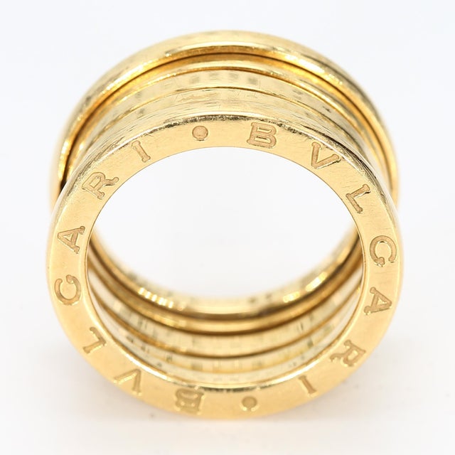 This is an 18k yellow gold BVLGARI B.zero1 movable ring which has a spring-like movement to it. Ring Size - 5.25 Total...