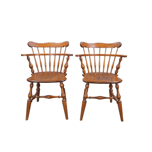 Two vintage Ethan Allen Heirloom Collection Comb Back Mate's armchairs. Made of maple featuring nutmeg finish. #10-6040....