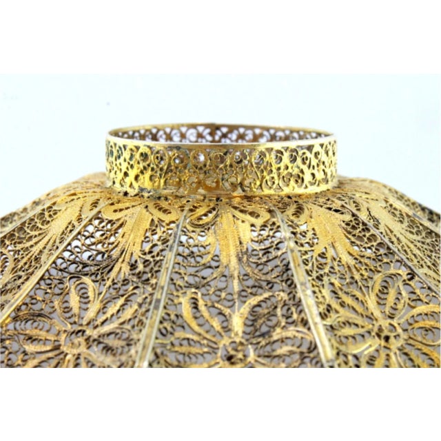 Gilded Silver Filigree Ring with Reliefs, in Very Good conditions. Designed from 2000 This piece has an attribution mark,...