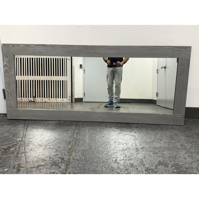 Design Plus Gallery presents a Gray Floor/Hanging Horizontal Mirror from CB2. The wide rectangular frame is rendered in...