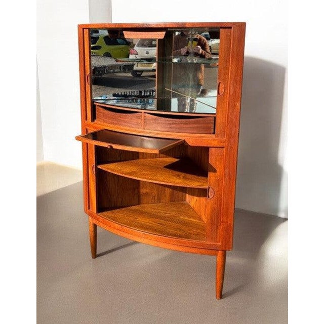 Mid Century Danish Teak Johannes Andersen Bow Tambour Front Corner Cocktail Cabinet. Sizes - 143.5 cms tall 100 cms wide...