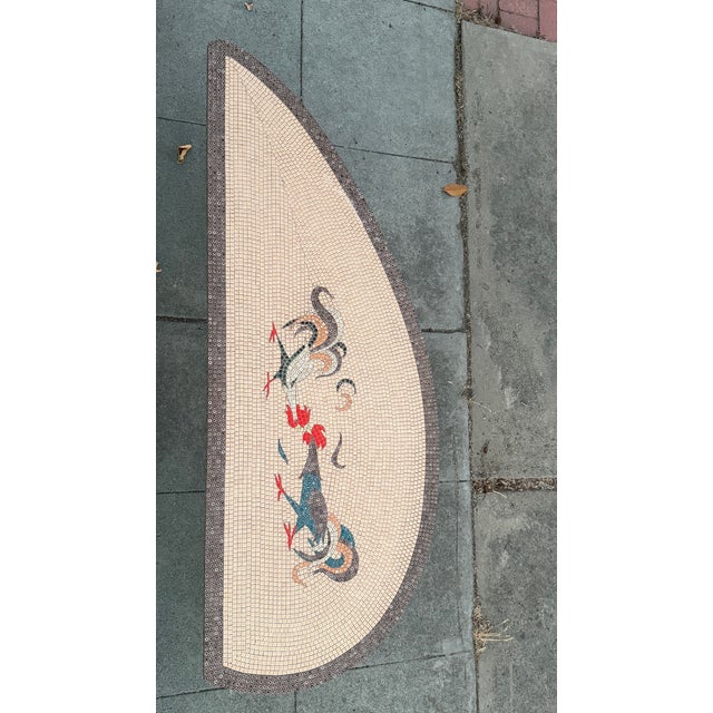 This vintage mid-century modern mosaic tiled coffee cocktail table features a unique roosters motif, adding a touch of...