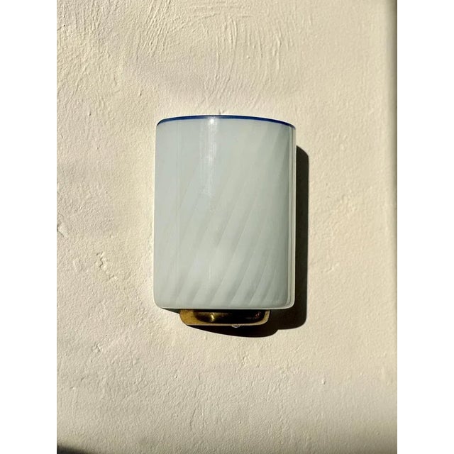 Timeless Murano glass sconces with brass base in beautiful, cosy baby blue colour with a dark blue rim. Murano glass...
