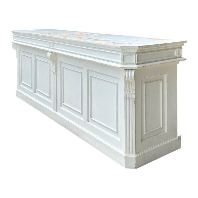 This monumental mid-century architectural counter is a stunning blend of utilitarian history and classical detail....