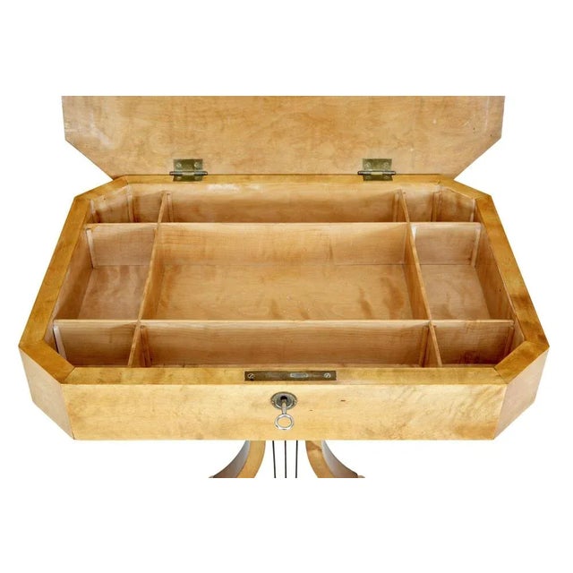 19th century swedish birch lyre shaped occasional table circa 1890. Rectangular top with canted corners. Hinged lid opens...
