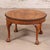 This 19th Century English Ball and Clawfoot Coffee Table with Book-Matched Top is a striking antique that showcases the...