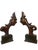 Striking pair of hand-carved sculptural architectural elements dating to the Art Deco period. Each figure features an...