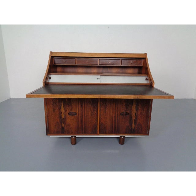 Two-piece Italian rosewood secretaire by Gianfranco Frattini for Bernini from the 1960s. This piece has an attribution...