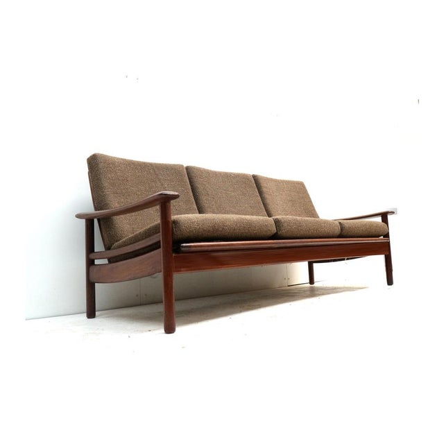 Vintage 3-seater Danish teak design sofa from the 1960s. Stylish vintage 3-seater sofa from Denmark, made in the 1960s and...
