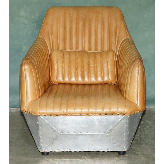 Mustang Fluted hand stitched and polished Aluminum riveted Aviator armchair in tan brown leather. A very good looking well...