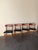 Beautiful set of four vintage Danish dining chairs crafted in solid teak with original black leather seats. These chairs...