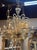 This vintage gold Murano glass chandelier with black trim exudes elegance and sophistication. Featuring beautiful curved...
