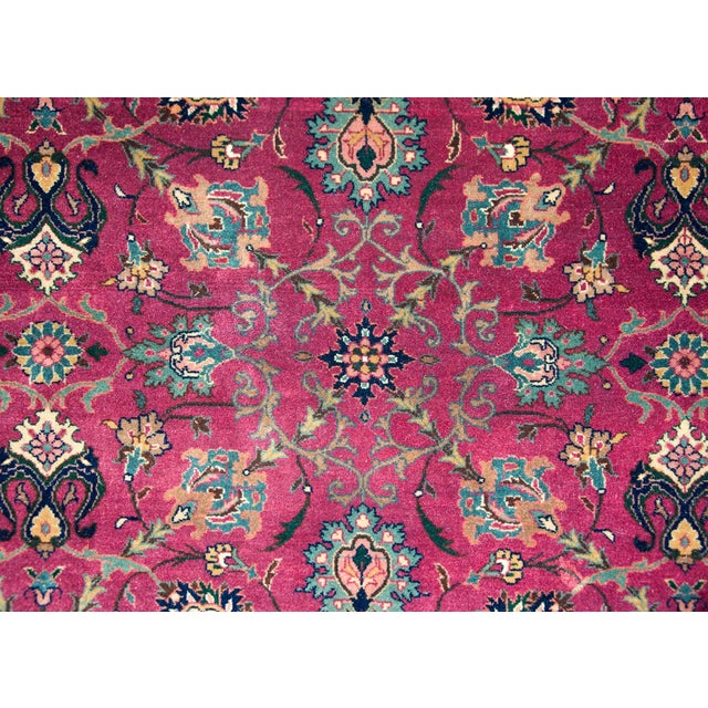 A wonderful late 20th century Pakistani Tabriz-style rug with an al-over mirrored floral trellis pattern woven with large-...