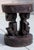 Authentic vintage hand-carved African figural stool featuring a male and female figure seated back-to-back, supporting a...