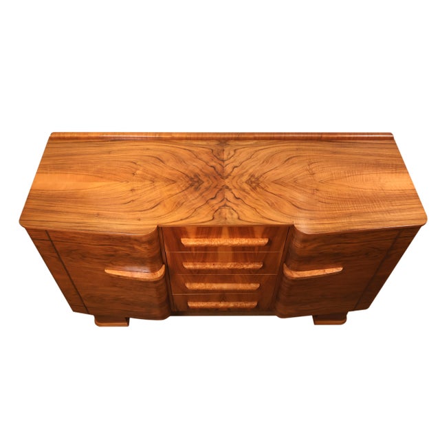 Art Deco Burl Walnut “Talent Series” Sideboard, Stamped F.H. Marshall & Co. This piece is an exceptional example of...