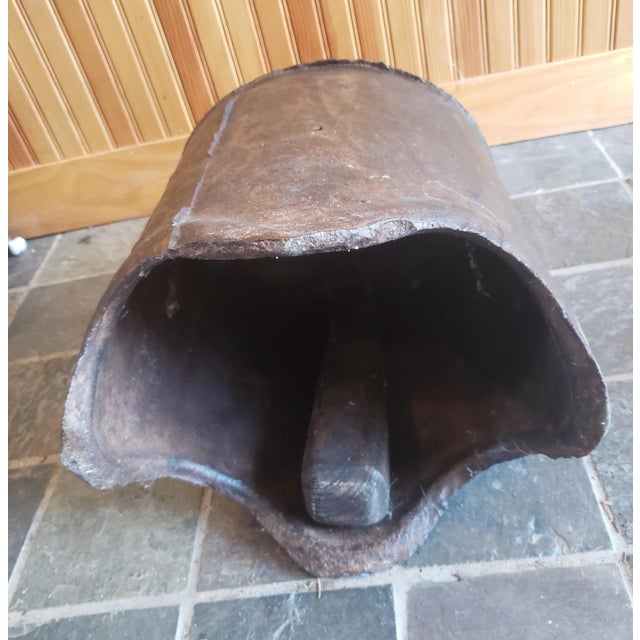 A Bonsho or Hanging Temple Bell from a Buddhist temple, made in the 18th C from iron and standing 18 inches high and 13...