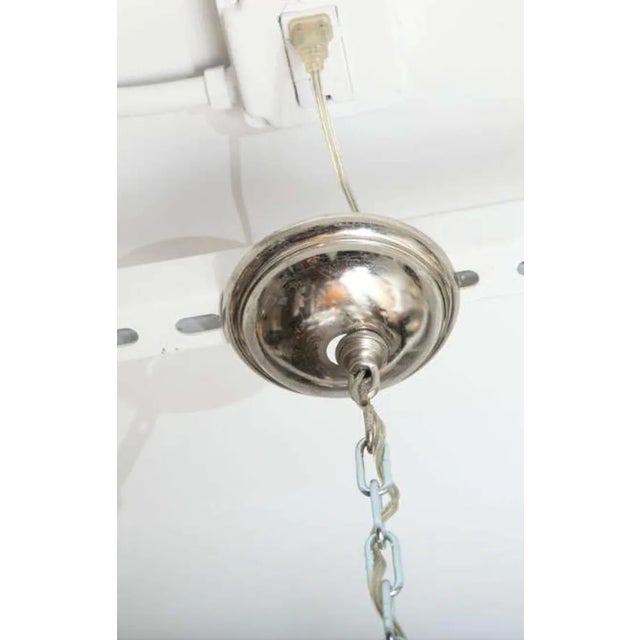 A stunning Venini glass chandelier made up of seven tiers of clear glass crystals.