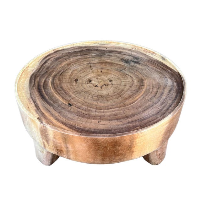 Sanded solid raw acacia wood low round coffee table. Beautiful natural grain and wood tones which will vary with each...