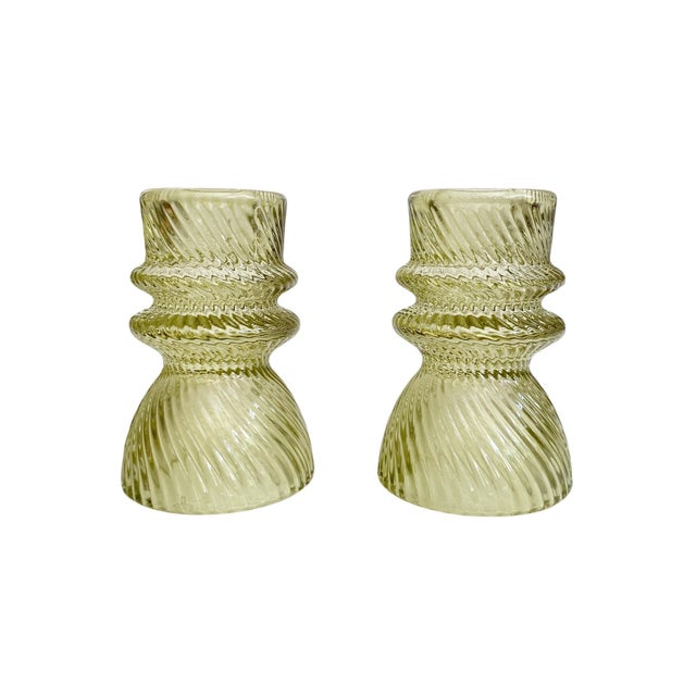 Elevate your home decor with these Transparent Green Ribbed Glass Taper Candle Holders, designed to add a touch of...