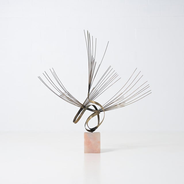 This unique Mid Century bronze and natural stone sculpture was designed by Curtis Jere. The curved and dynamic shape made...