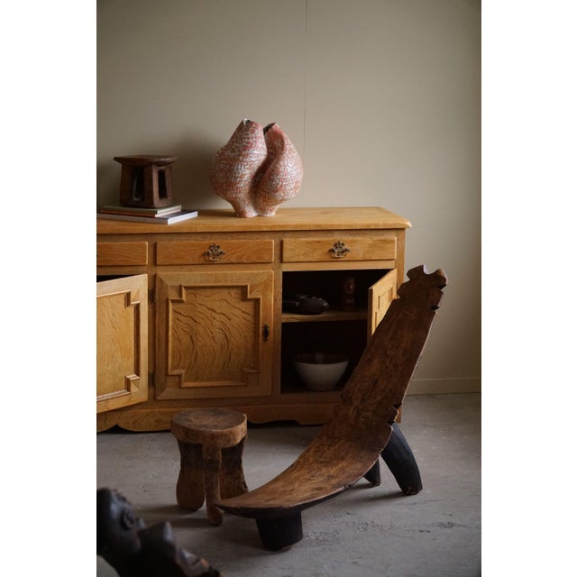A highly decorative African Lobi chair, crafted in Burkina Faso during the 1940s. This type of stool / chair was for...
