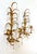 Striking pair of Italian gilt tole wall sconces with curling metal branches, floral candle cups, and an abundance of clear...