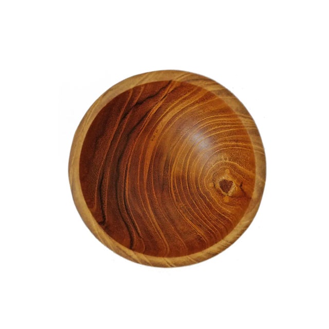 Simple small hand carved and sanded teak wood bowl. Each unique in natural tones, grain, and imperfections. Each sold...