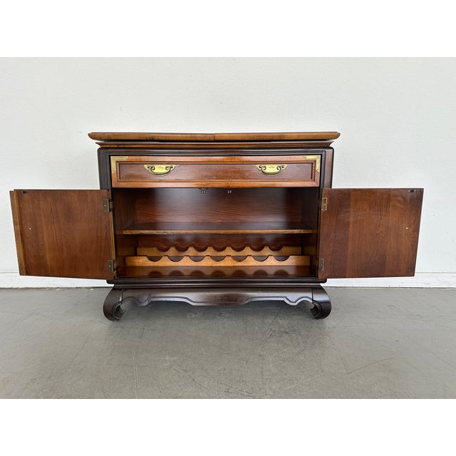 This striking flip-top buffet and bar cabinet is from the Broyhill Premier “Ming Dynasty” Collection, produced in the late...