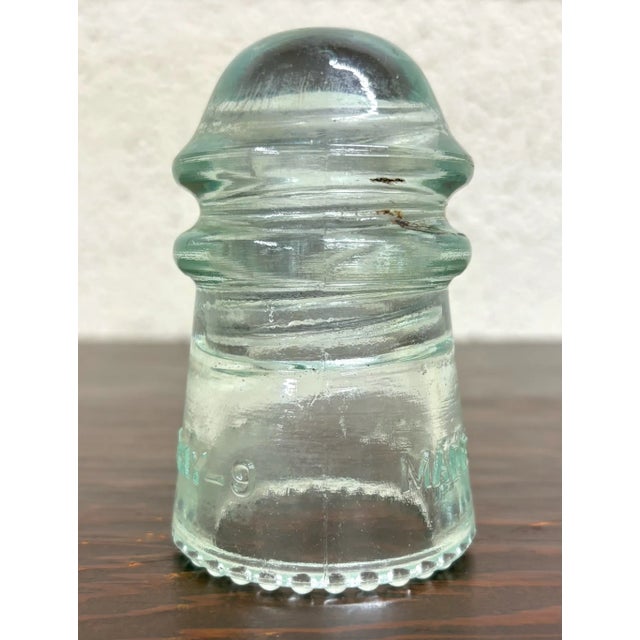 This is a gorgeous clear vintage glass Hemingray insulator with a teal or aqua tint. “Hemingray-9” Several insulators in...