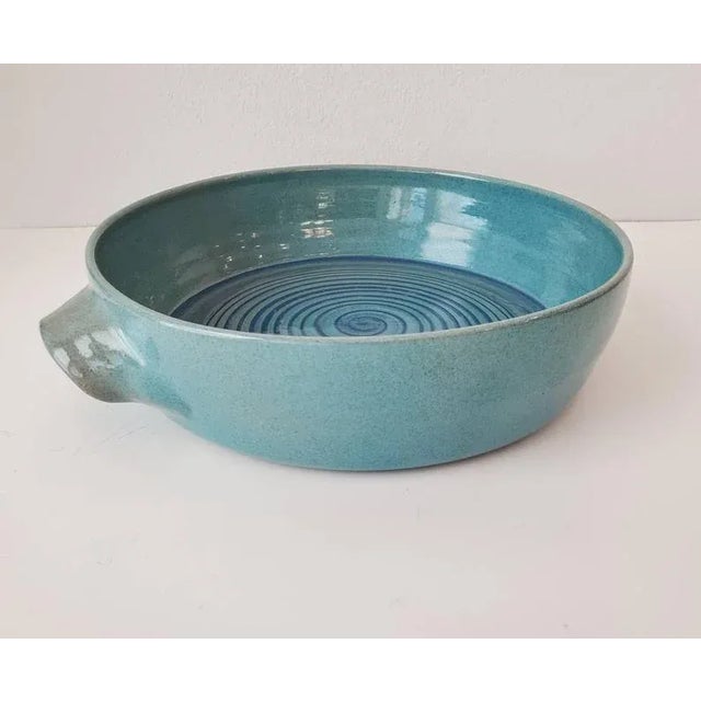 Early and rare hand-thrown ceramic serving dish by midcentury modern masters, Edwin and Mary Scheier. With curved handles...