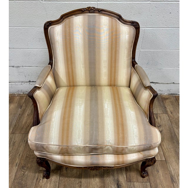 This is a gorgeous antique French Louis XV carved Bergere chair or fauteuil, believed to be beechwood and believed to be...