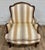This is a gorgeous antique French Louis XV carved Bergere chair or fauteuil, believed to be beechwood and believed to be...